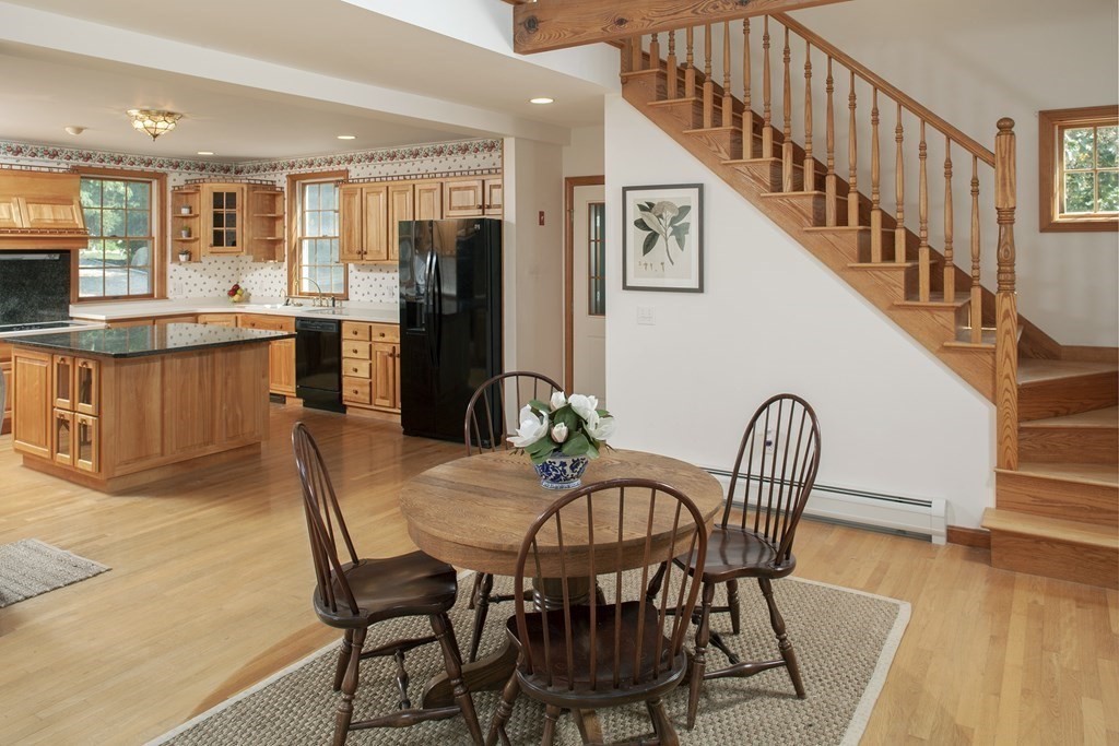 93 Beach Road Orleans, MA 02653 - Photo 14 of 28 a view of a dining room with furniture and wooden floor