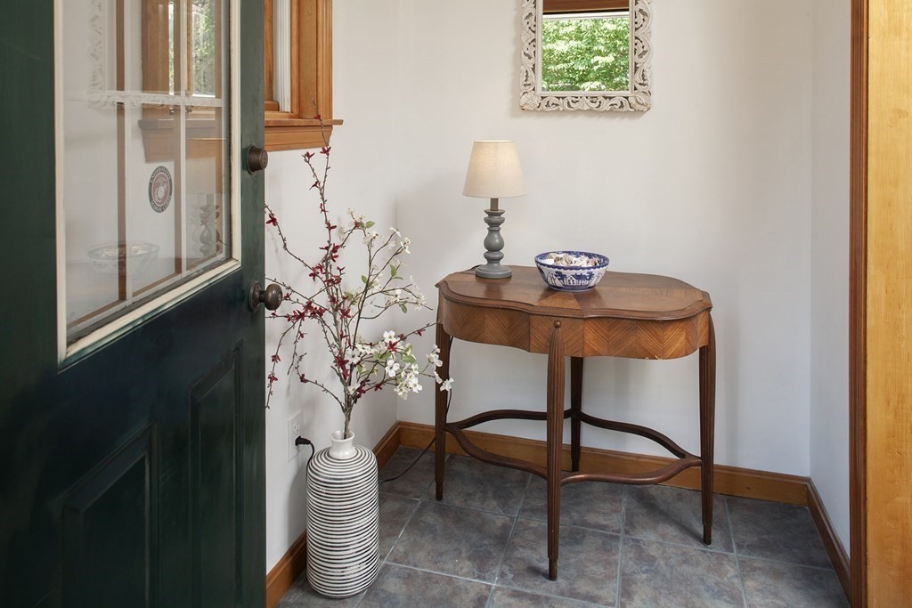 93 Beach Road Orleans, MA 02653 - Photo 23 of 28 a room with a table and a potted plant