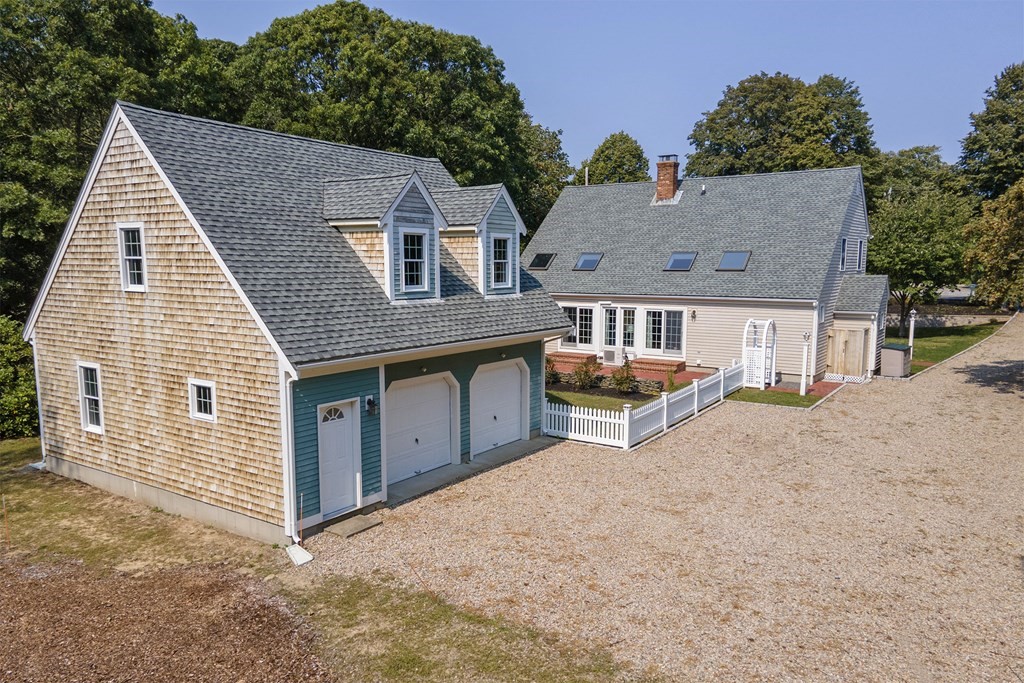 93 Beach Road Orleans, MA 02653 - Photo 3 of 28 a view of a house with a yard