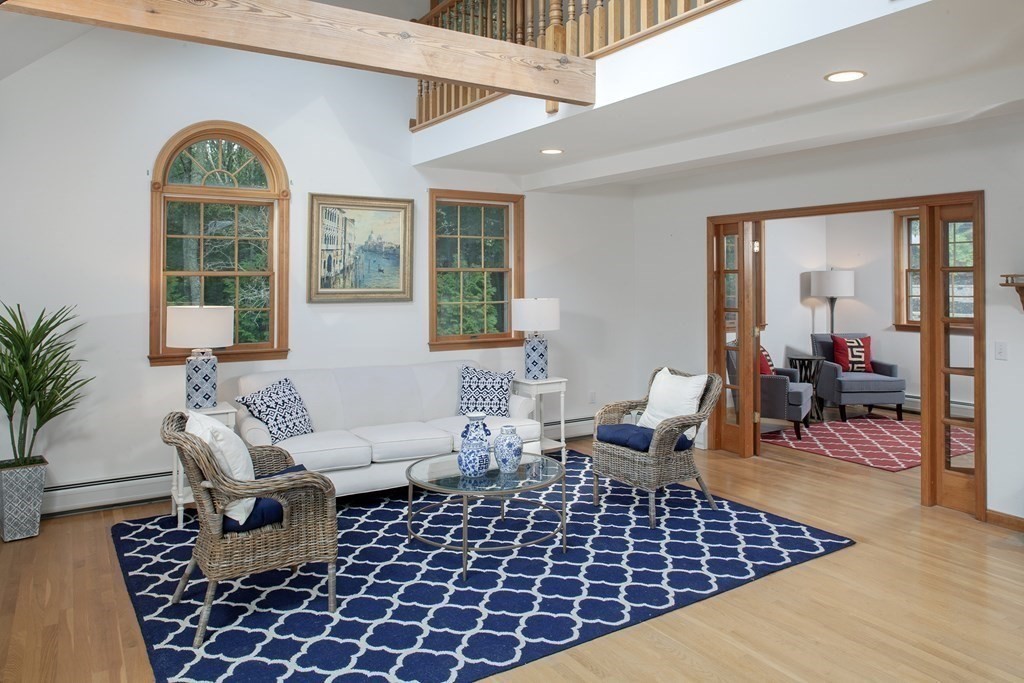 93 Beach Road Orleans, MA 02653 - Photo 6 of 28 a living room with furniture a rug and a large window