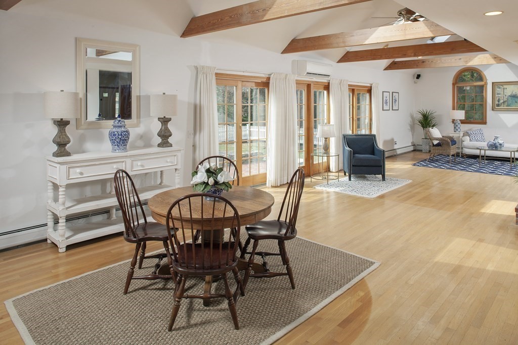93 Beach Road Orleans, MA 02653 - Photo 10 of 28 a view of a dining room with furniture and wooden floor