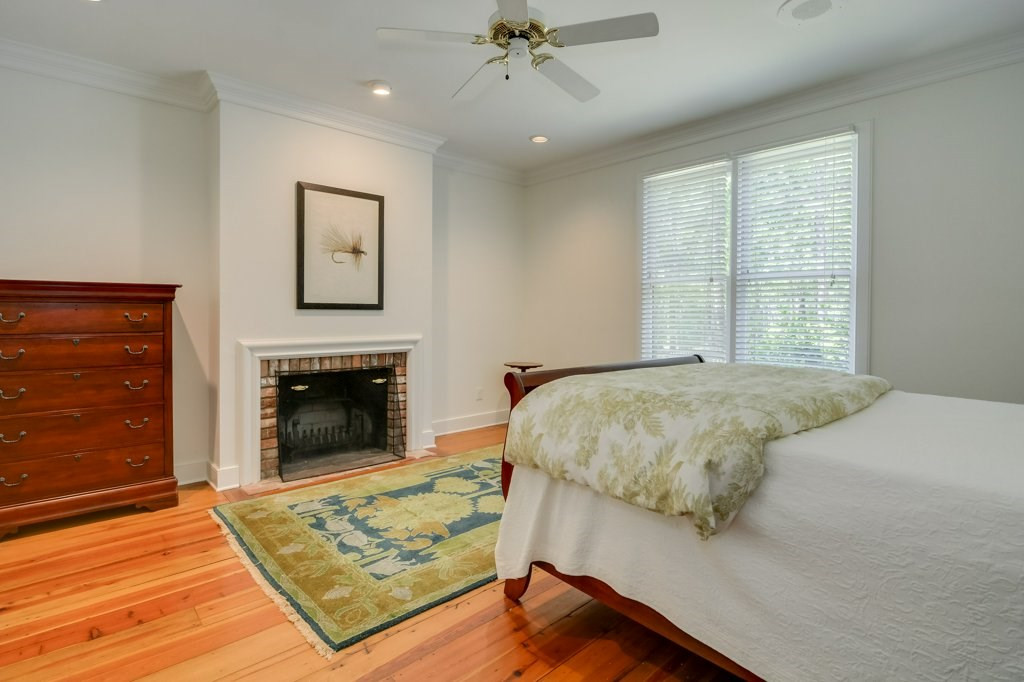 191 North Martintown Road Edgefield, SC 29824 - Photo 32 of 75 a bedroom with a bed and a fireplace
