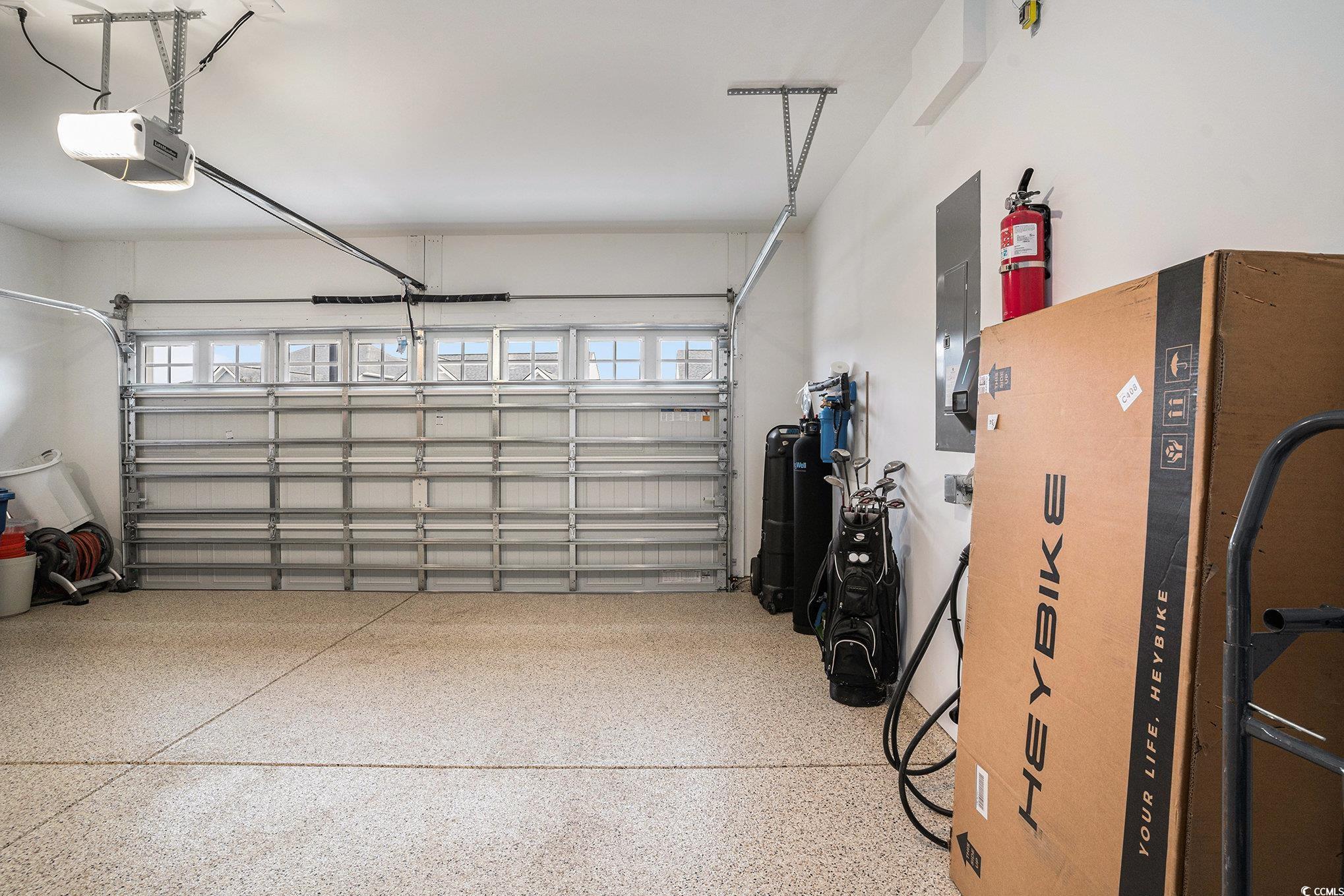 1609 Littleleaf Loop North Myrtle Beach, SC 29582 - Photo 28 of 40 Garage with a garage door opener and electric panel