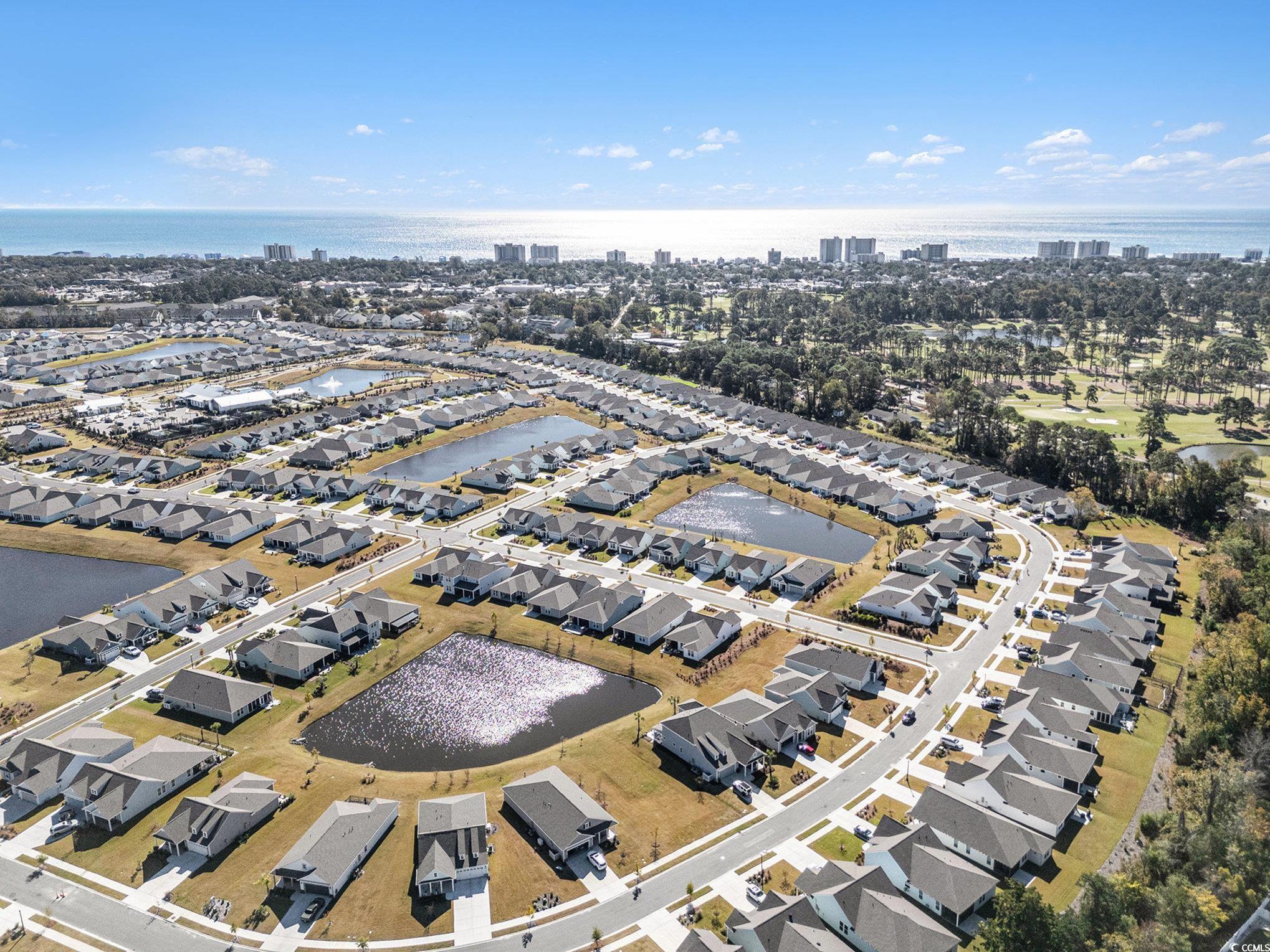1609 Littleleaf Loop North Myrtle Beach, SC 29582 - Photo 34 of 40 Aerial overview of property's location featuring a large body of water and nearby suburban area