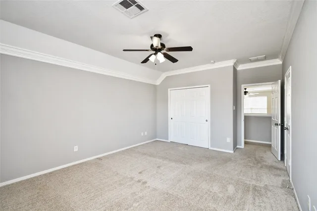 a view of a chandelier fan in a room