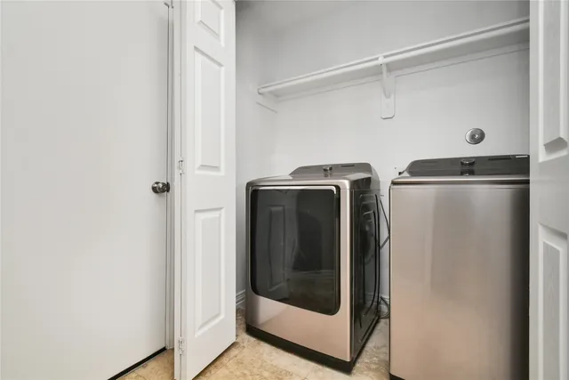 a utility room with washer and dryer