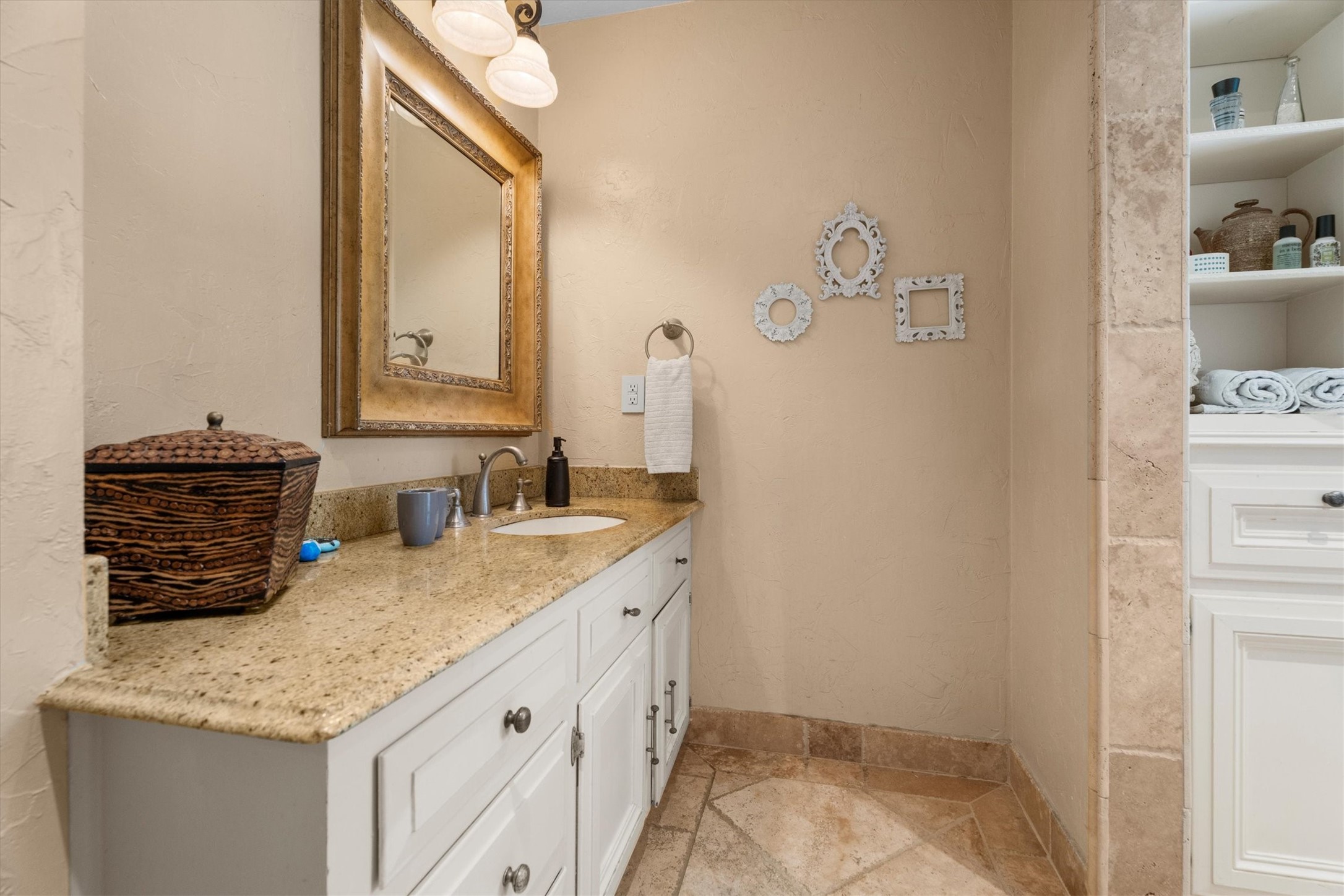 9103 Herts Road Spring, TX 77379 - Photo 33 of 46 The thoughtfully laid out secondary bathroom includes a large vanity, separated from the shower/tub combo by a custom arch.