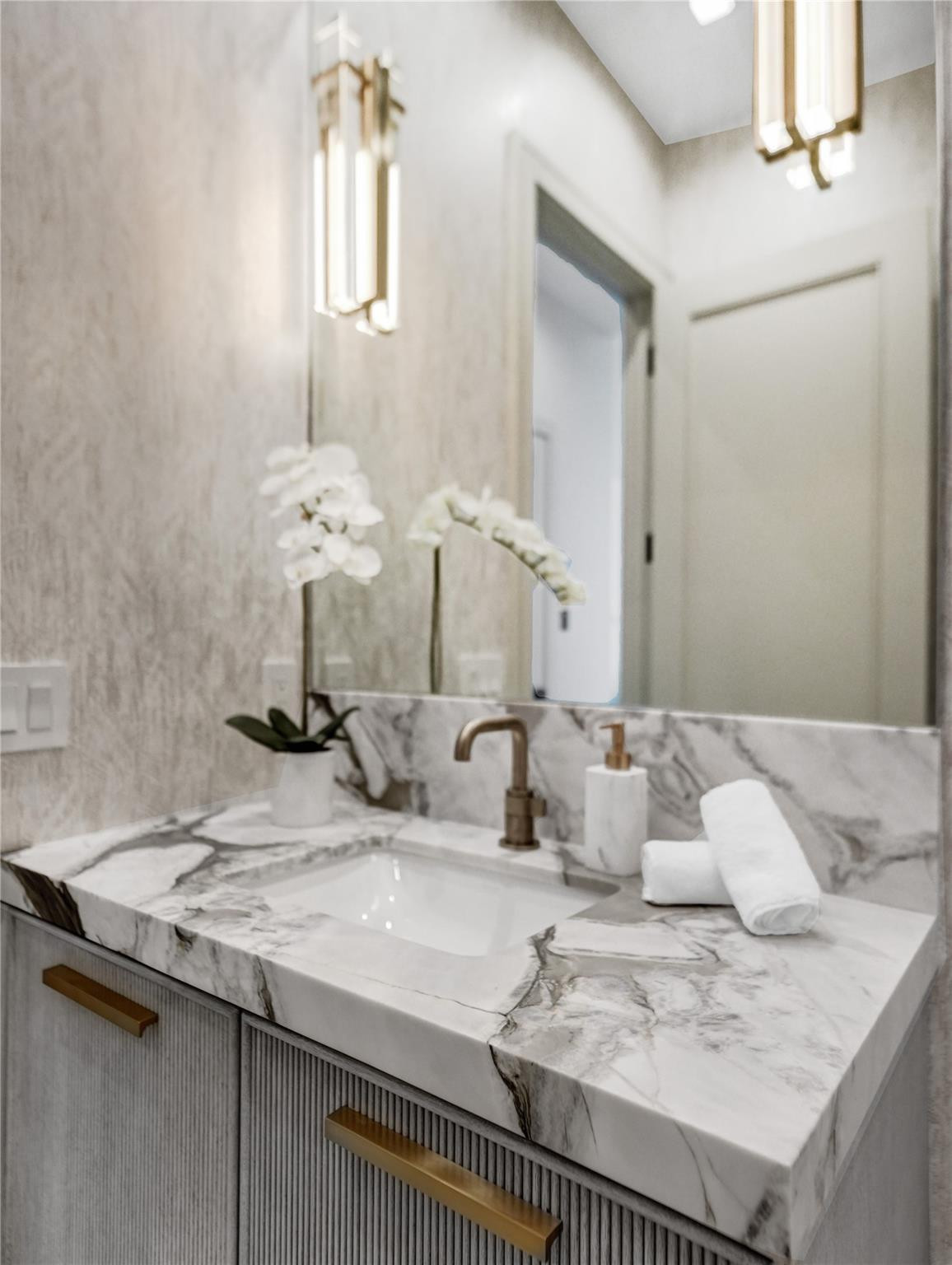 7 Seneca Road Sea Ranch Lakes, FL 33308 - Photo 11 of 65 a bathroom with a sink and a mirror