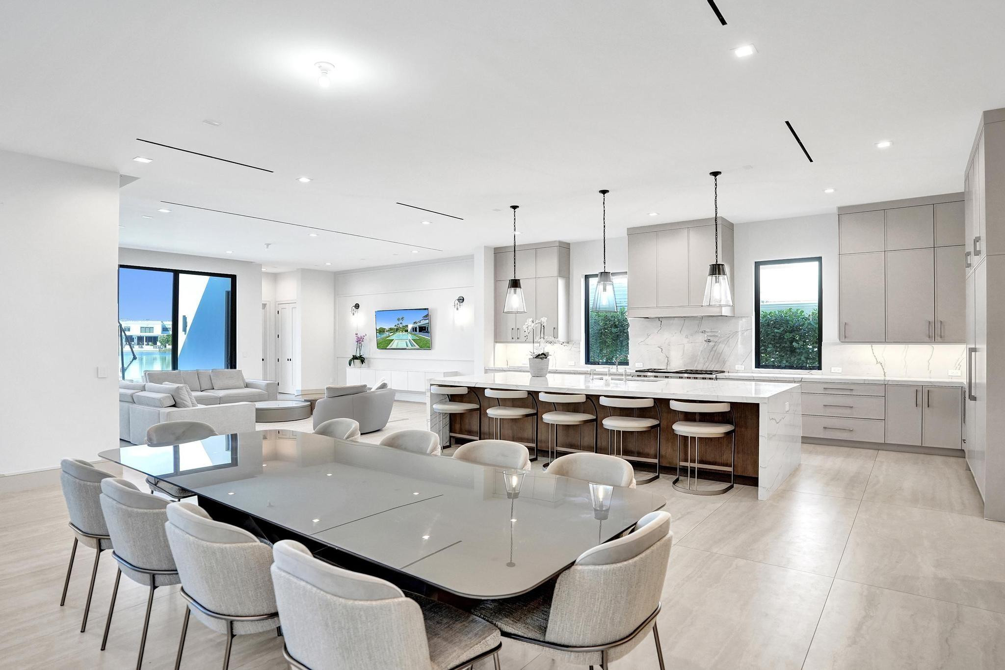 7 Seneca Road Sea Ranch Lakes, FL 33308 - Photo 13 of 65 a large kitchen with a table and chairs