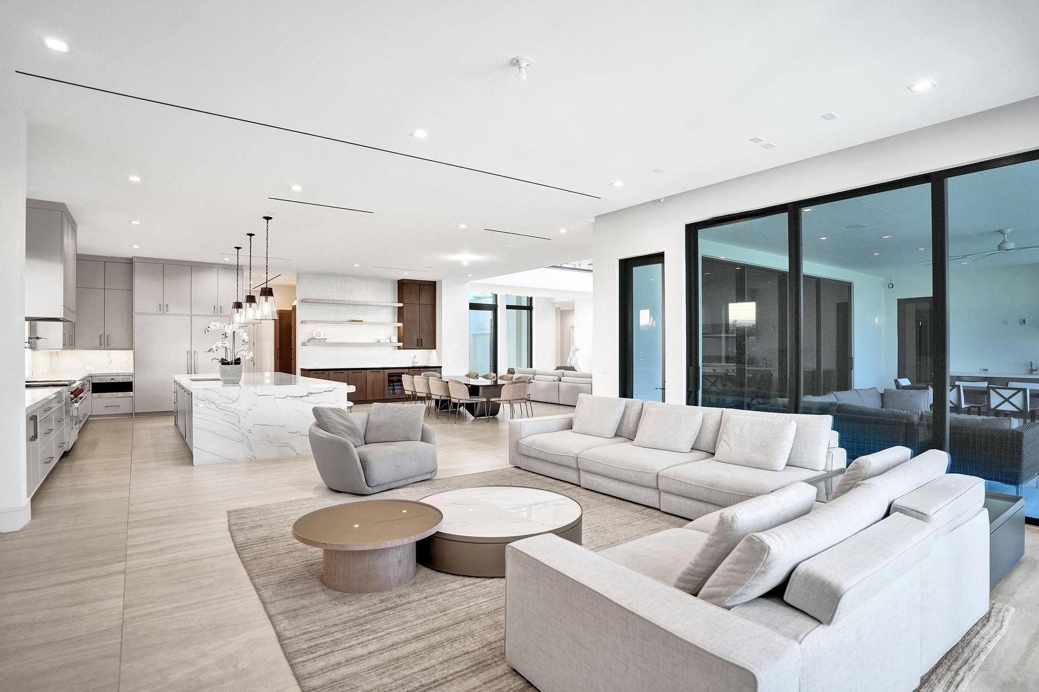 7 Seneca Road Sea Ranch Lakes, FL 33308 - Photo 18 of 65 a living room with furniture and a large window