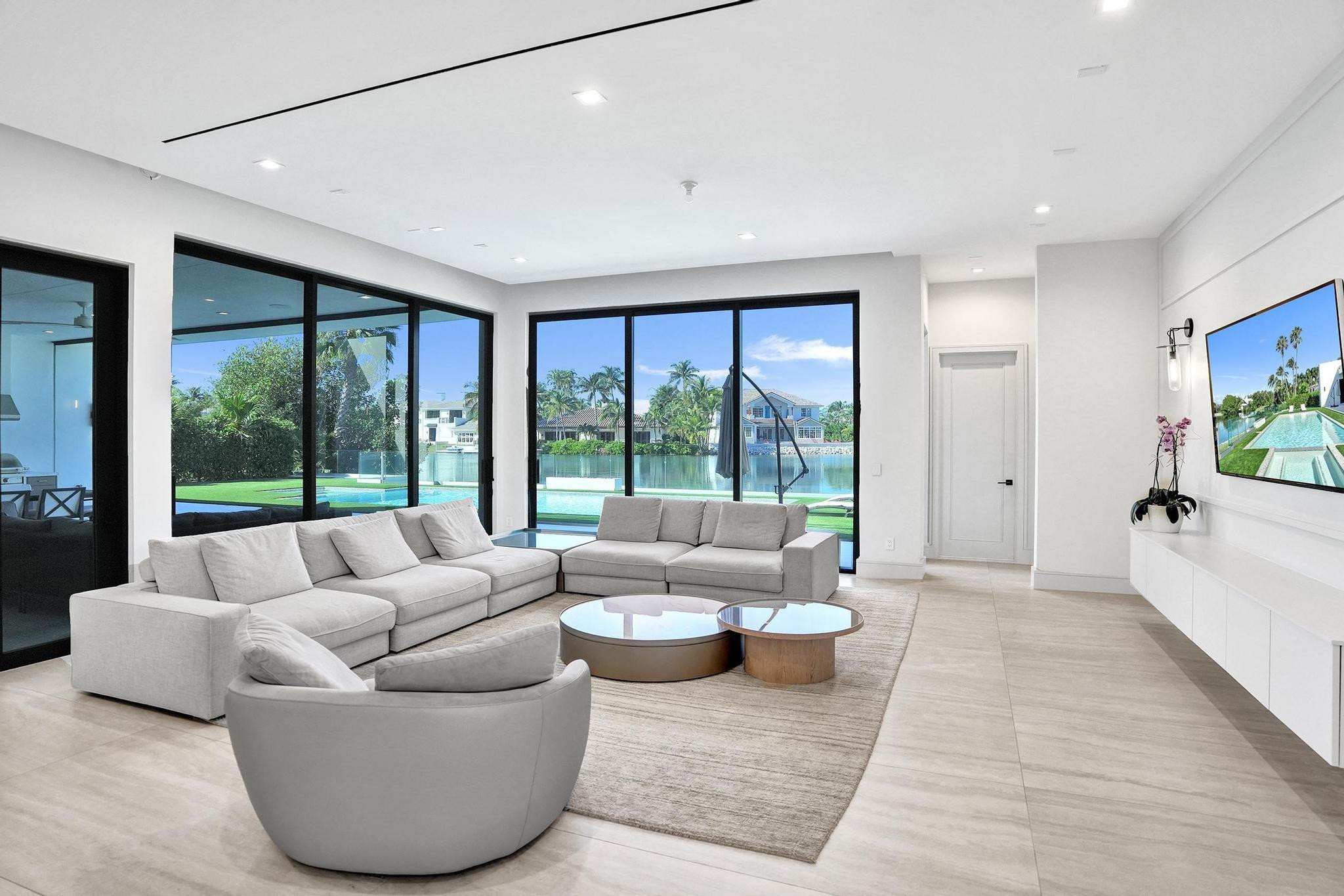 7 Seneca Road Sea Ranch Lakes, FL 33308 - Photo 19 of 65 a living room with furniture and a large window