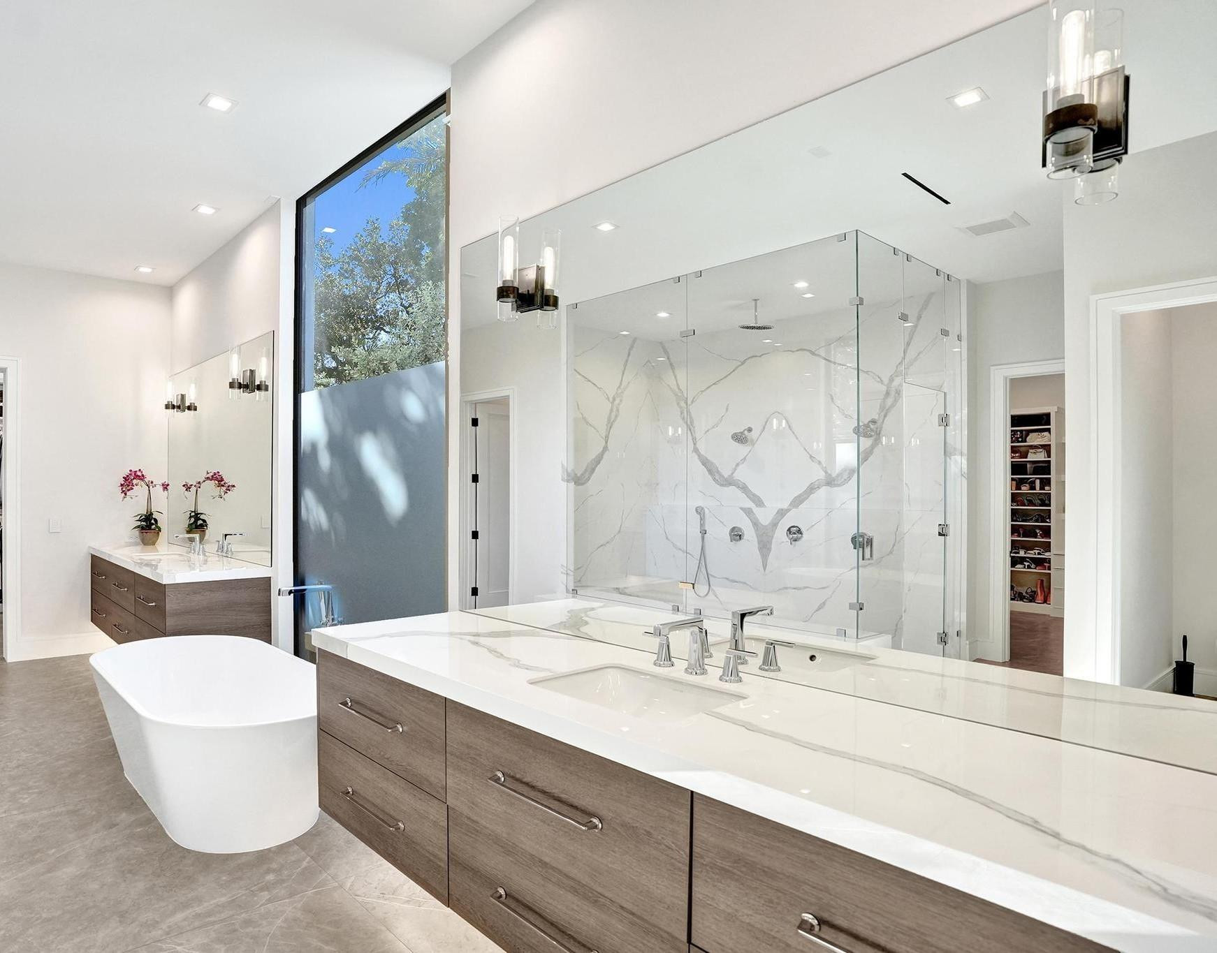 7 Seneca Road Sea Ranch Lakes, FL 33308 - Photo 24 of 65 a bathroom with a double vanity sink mirror and double