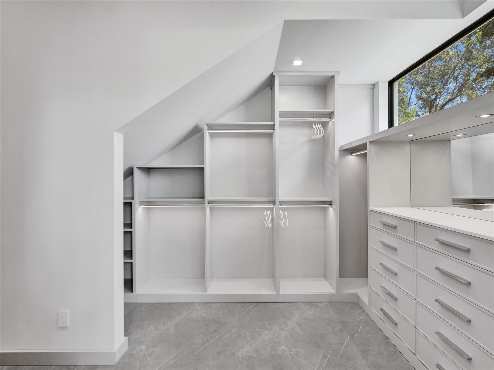 7 Seneca Road Sea Ranch Lakes, FL 33308 - Photo 28 of 65 a view of walk in closet with empty racks