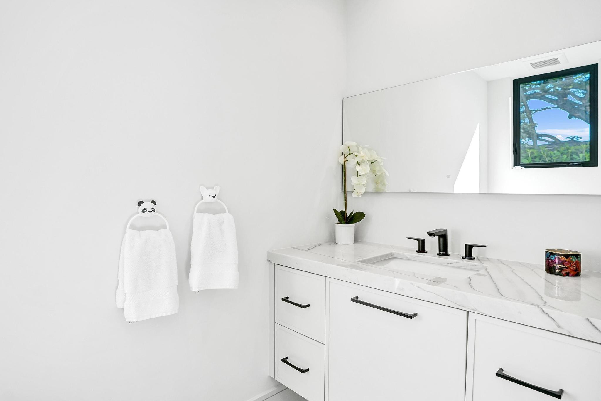 7 Seneca Road Sea Ranch Lakes, FL 33308 - Photo 31 of 65 a bathroom with a sink and a mirror