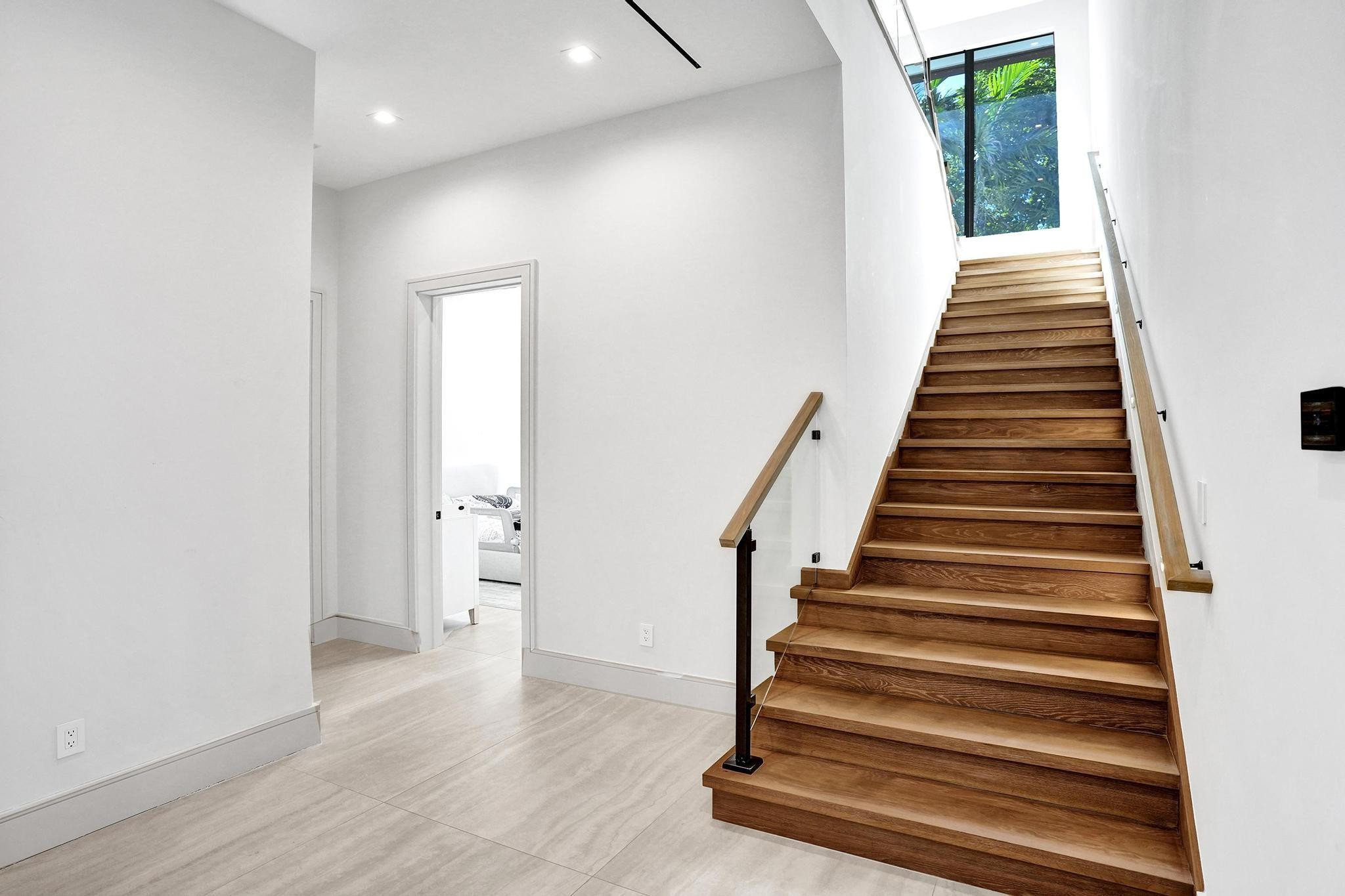 7 Seneca Road Sea Ranch Lakes, FL 33308 - Photo 32 of 65 a view of entryway with wooden floor