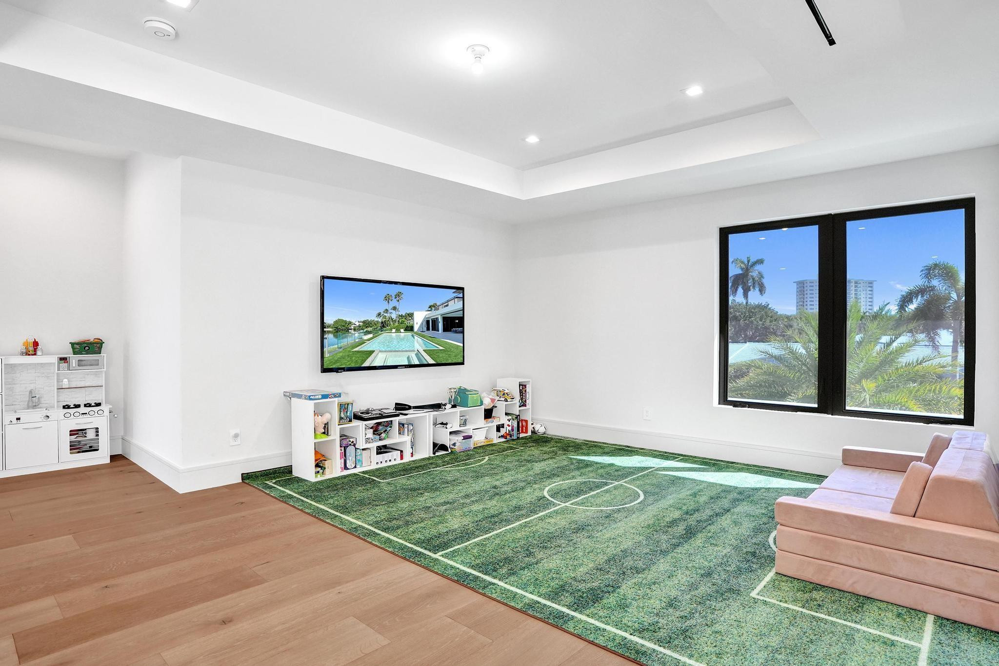 7 Seneca Road Sea Ranch Lakes, FL 33308 - Photo 33 of 65 a living room with furniture and a flat screen tv