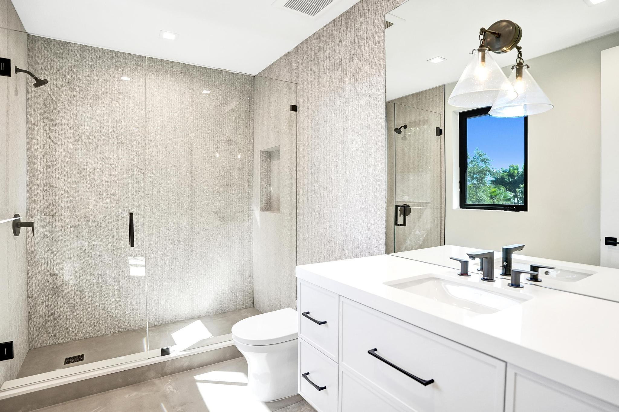 7 Seneca Road Sea Ranch Lakes, FL 33308 - Photo 37 of 65 a bathroom with a sink a toilet and shower