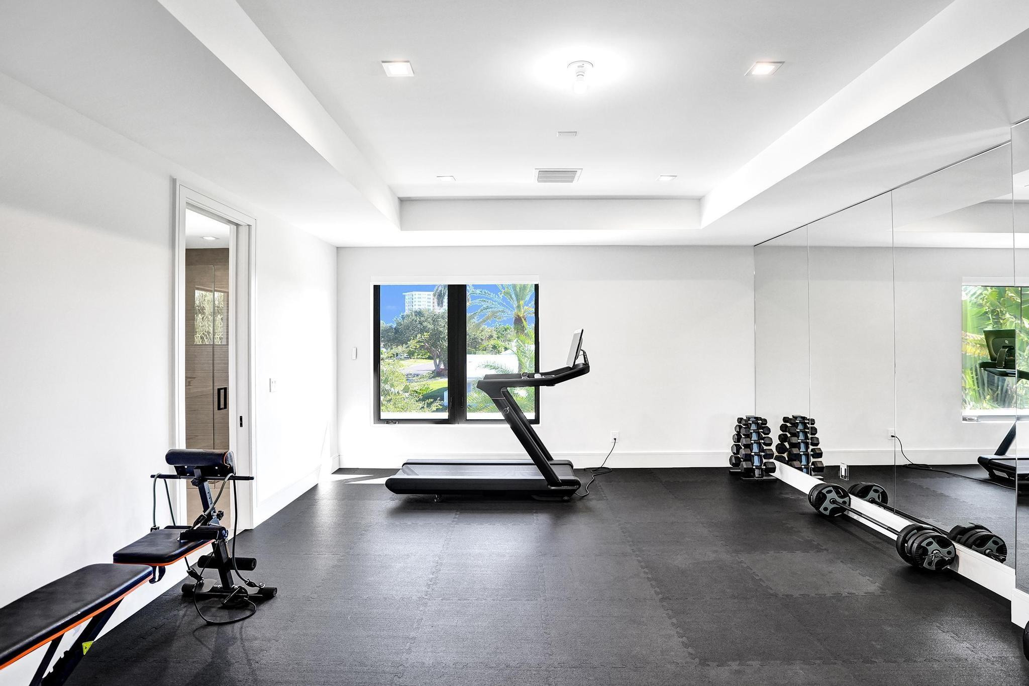 7 Seneca Road Sea Ranch Lakes, FL 33308 - Photo 39 of 65 a view of a room with gym equipment