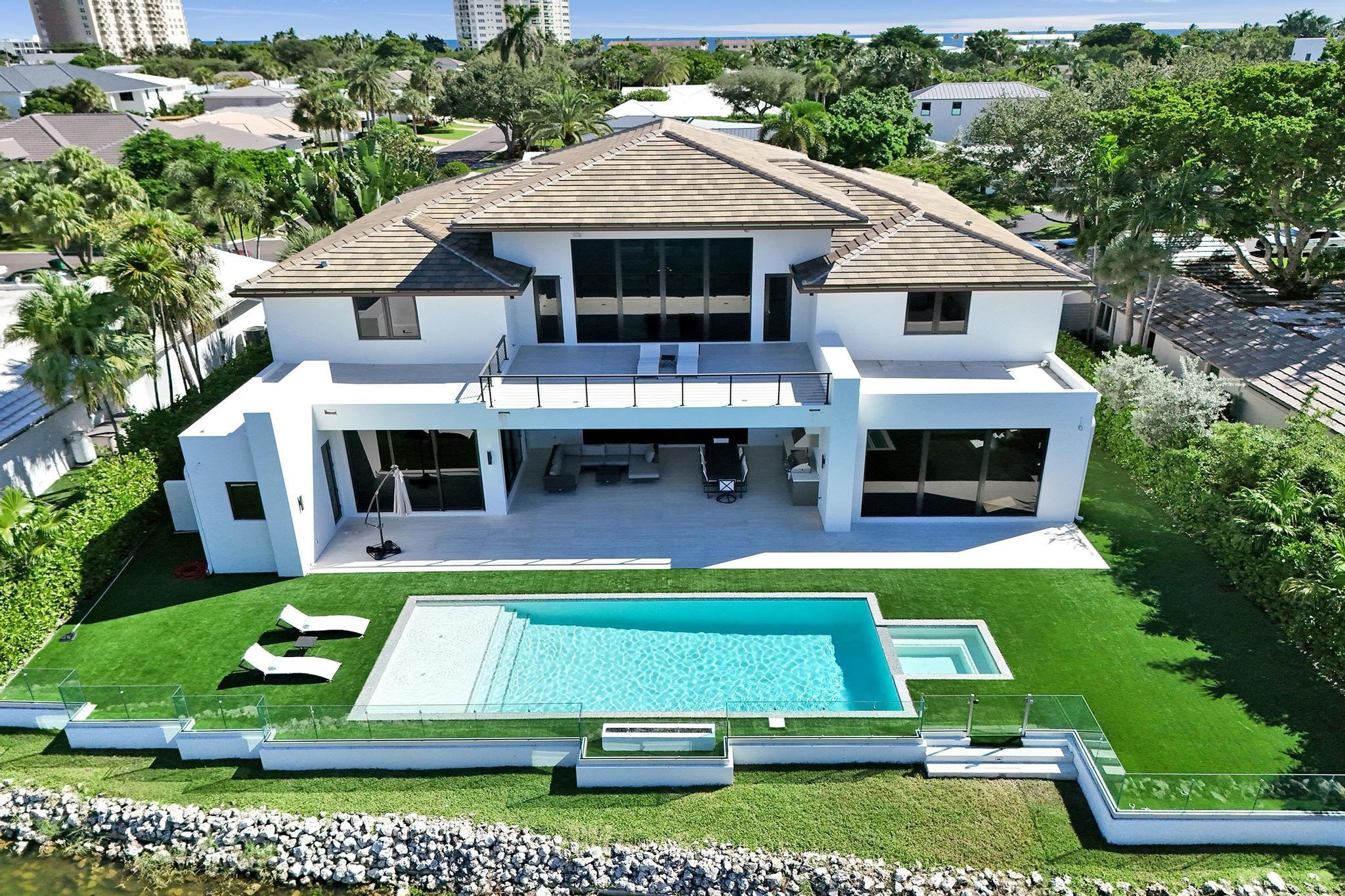 7 Seneca Road Sea Ranch Lakes, FL 33308 - Photo 4 of 65 a aerial view of a house with swimming pool