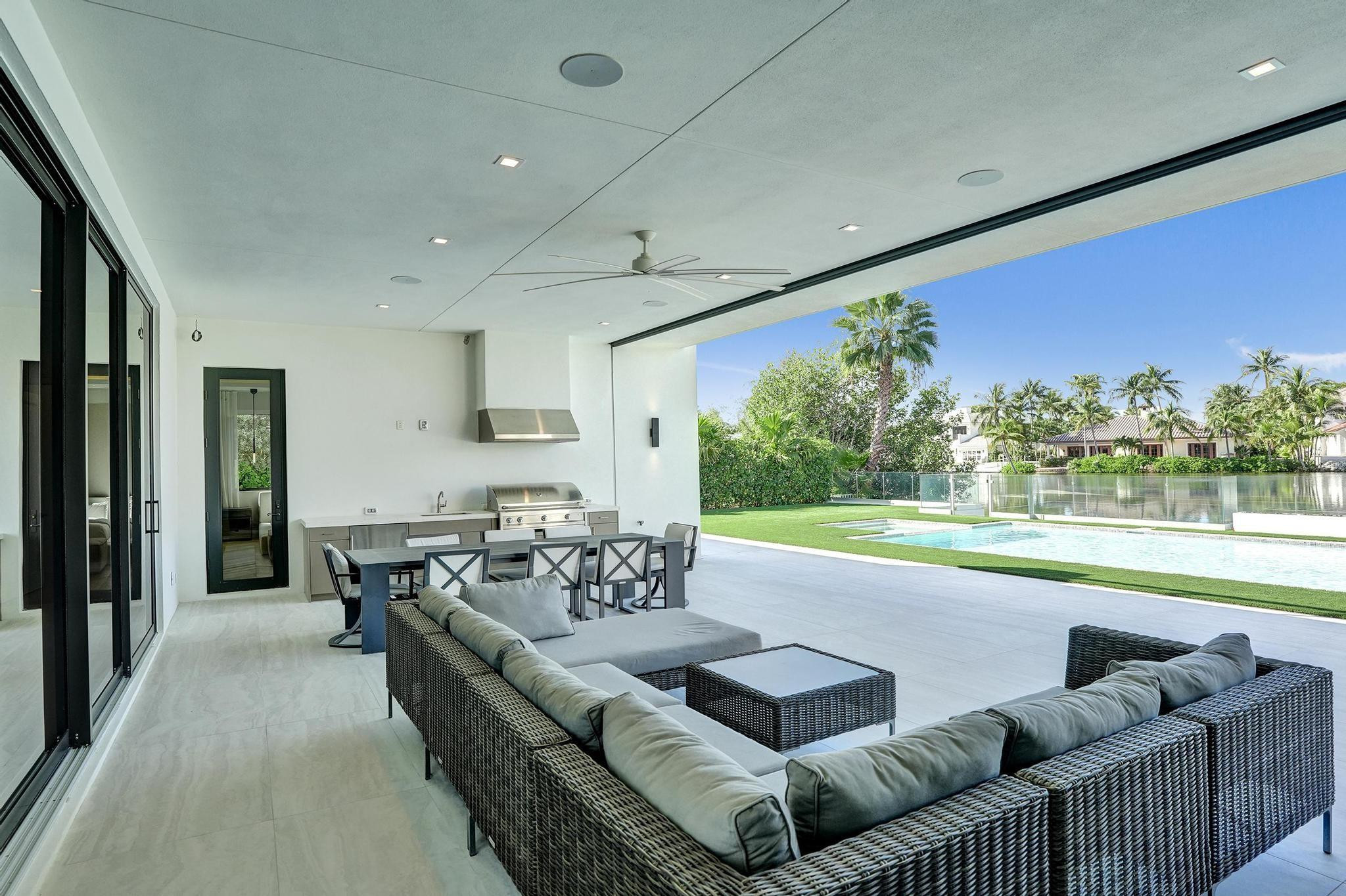 7 Seneca Road Sea Ranch Lakes, FL 33308 - Photo 43 of 65 a living room with furniture and a large window