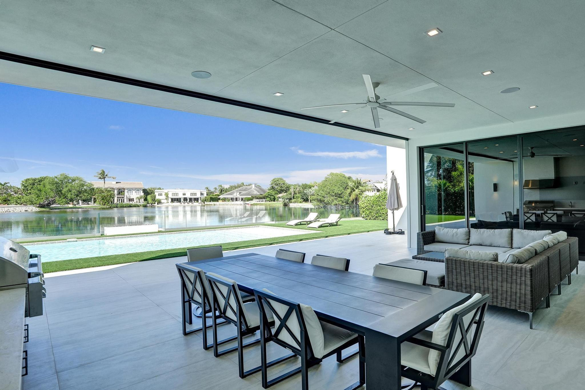 7 Seneca Road Sea Ranch Lakes, FL 33308 - Photo 44 of 65 a view of a dining room with furniture window and outside view