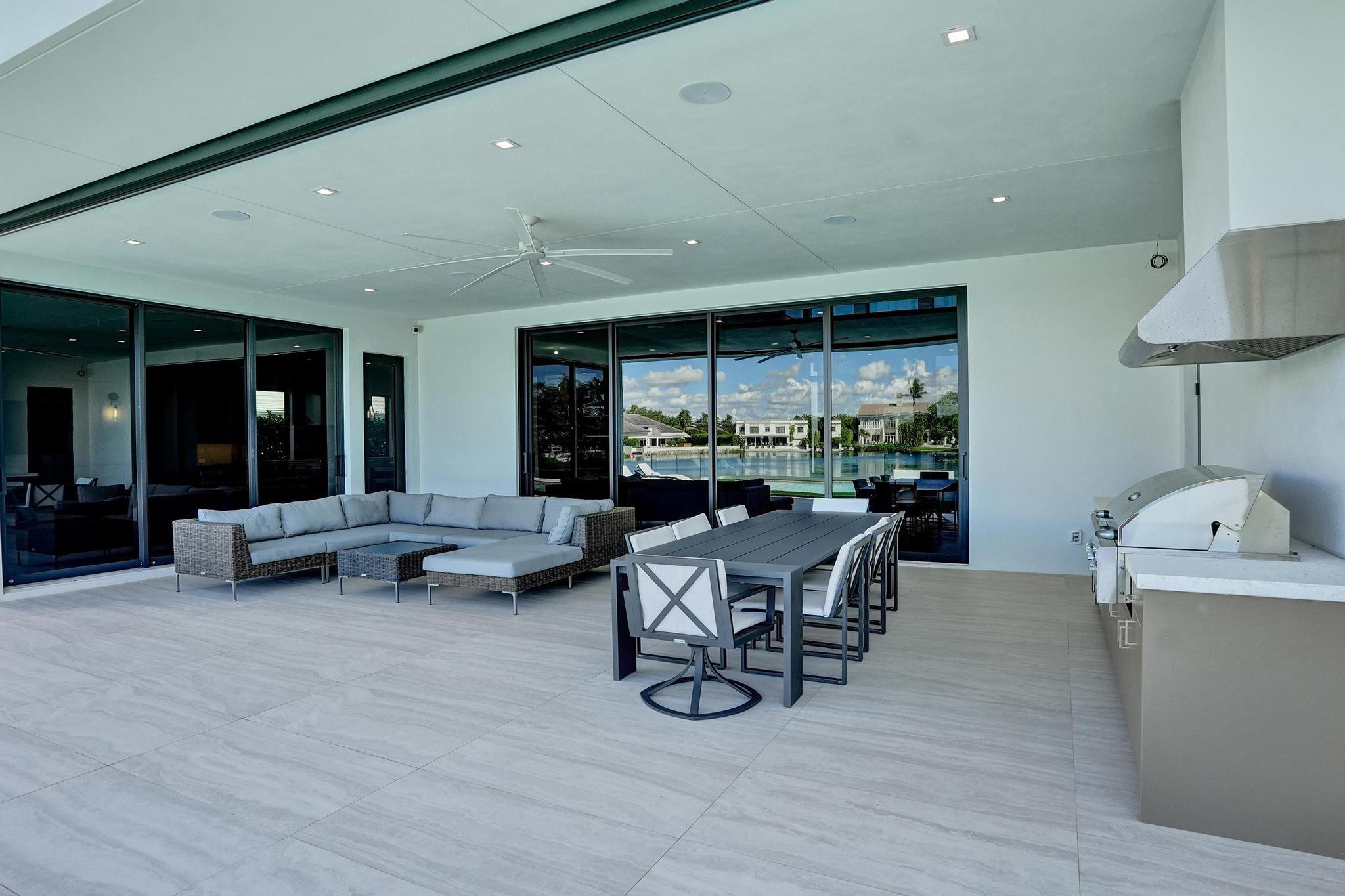 7 Seneca Road Sea Ranch Lakes, FL 33308 - Photo 45 of 65 a living room with furniture and a large window