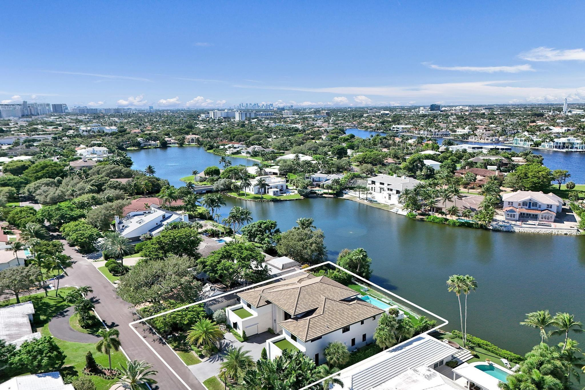 7 Seneca Road Sea Ranch Lakes, FL 33308 - Photo 5 of 65 an aerial view of a city with lots of residential buildings lake and ocean view