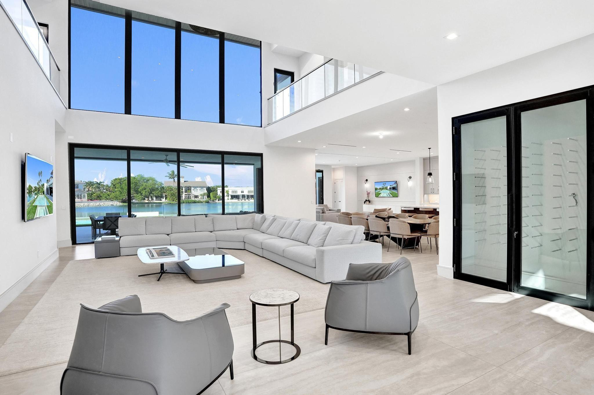 7 Seneca Road Sea Ranch Lakes, FL 33308 - Photo 8 of 65 a living room with furniture and a large window