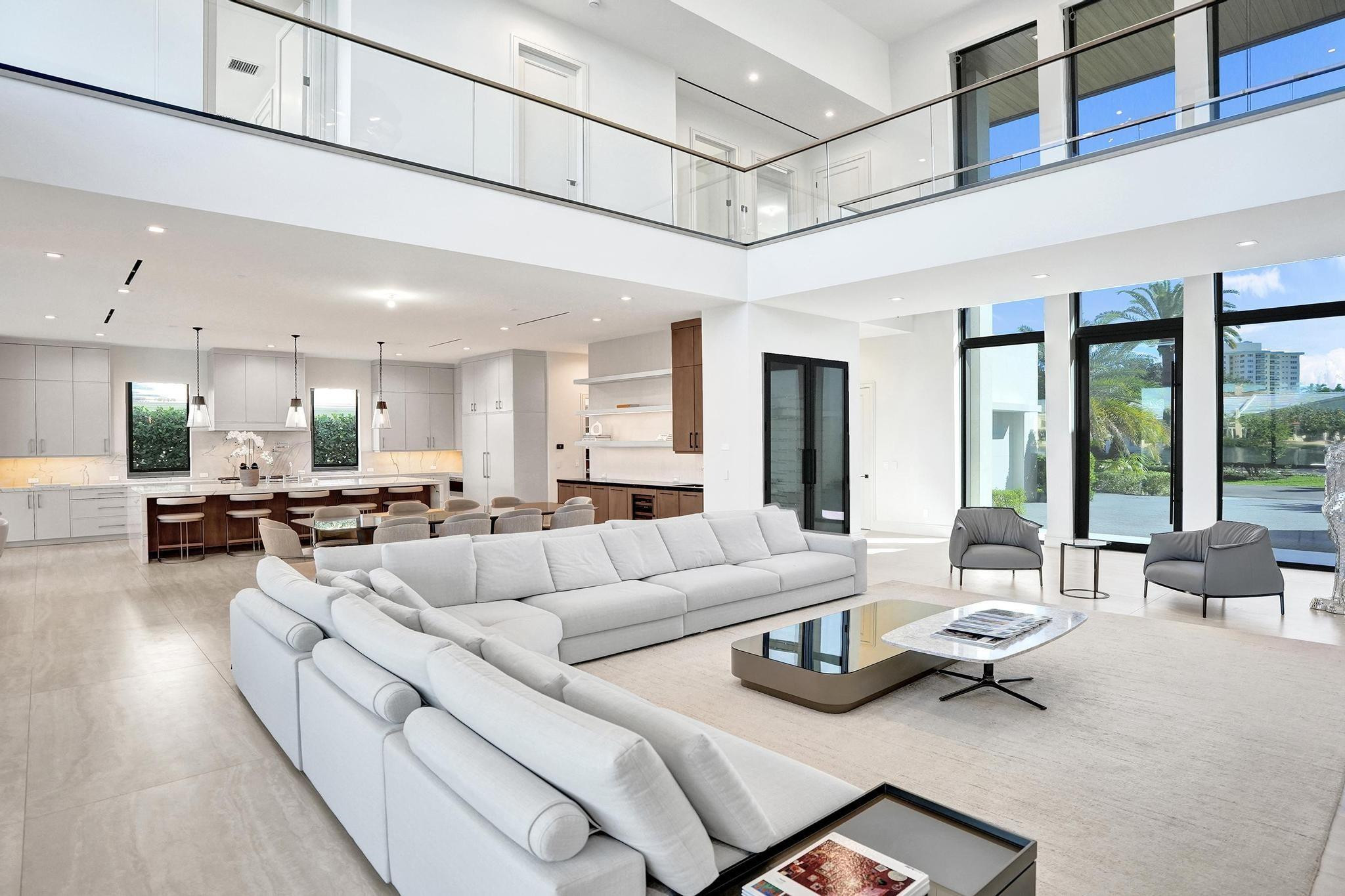 7 Seneca Road Sea Ranch Lakes, FL 33308 - Photo 9 of 65 a living room with furniture and a large window