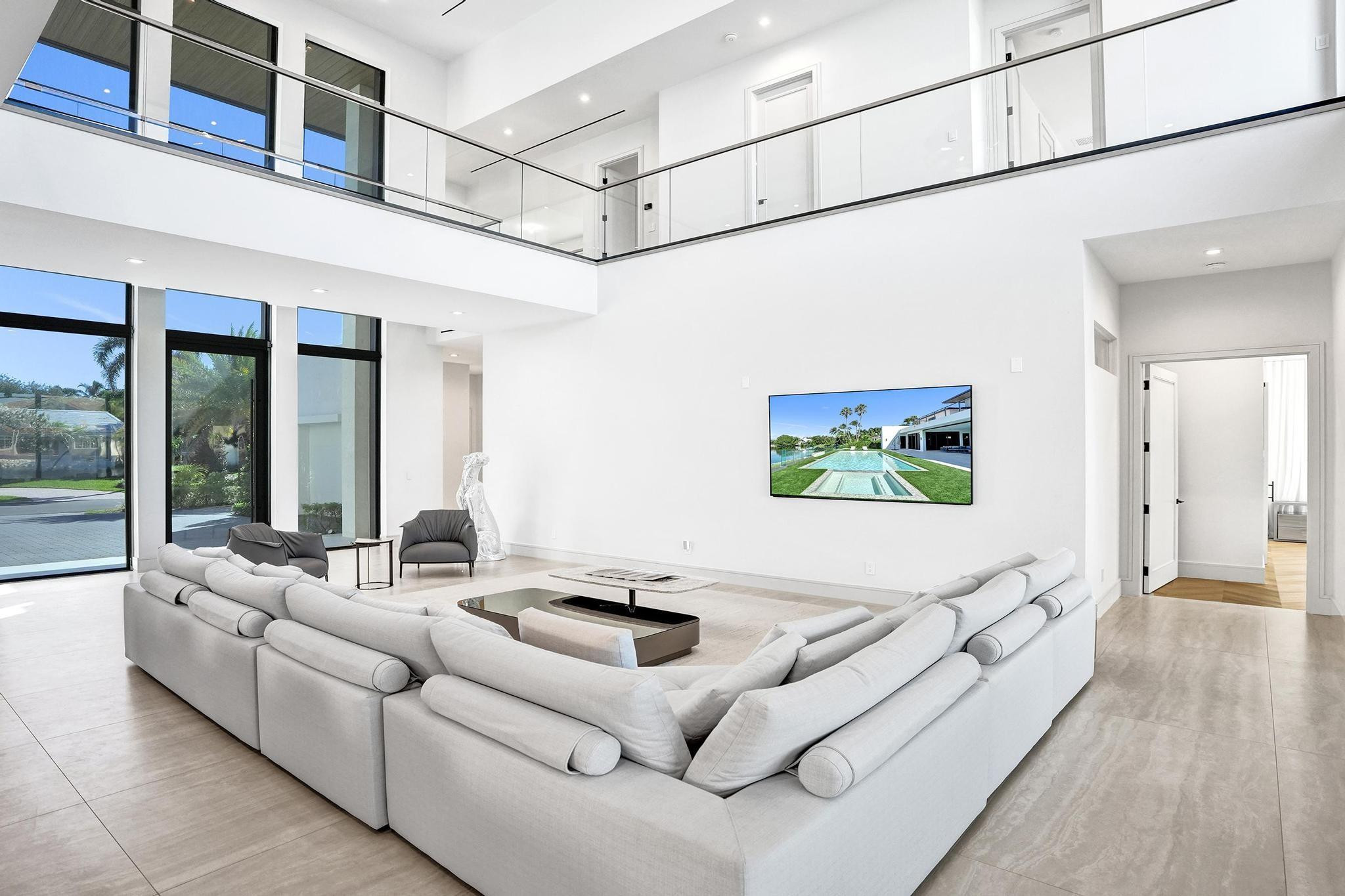 7 Seneca Road Sea Ranch Lakes, FL 33308 - Photo 10 of 65 a living room with furniture and a flat screen tv