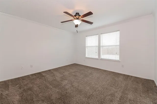 a kitchen with stainless steel appliances granite countertop a stove cabinets a refrigerator and a sink