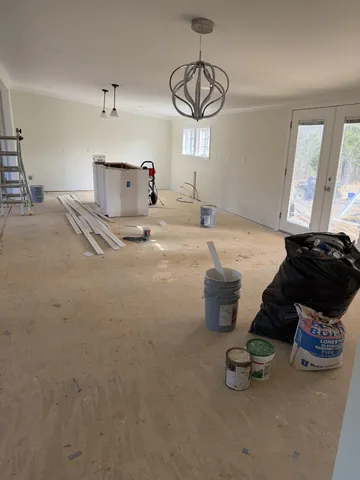 a spacious bedroom with a bed and window