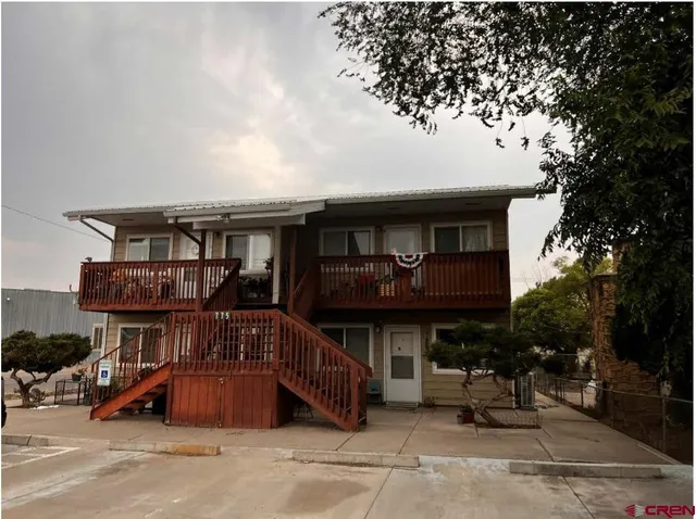 a front view of house with outdoor seating
