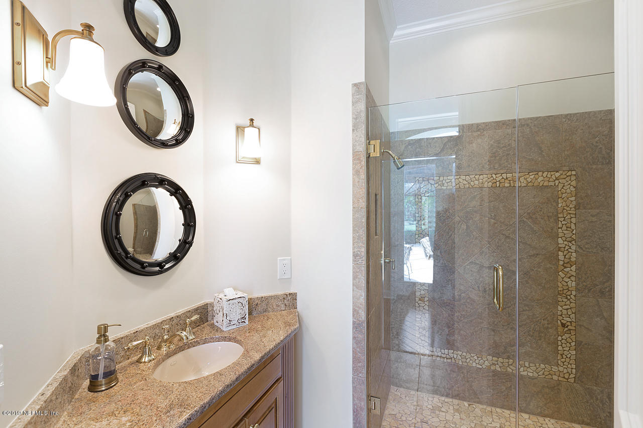 116 Governors Road Ponte Vedra Beach, FL 32082 - Photo 11 of 57 a bathroom with a granite countertop double vanity sink and a mirror