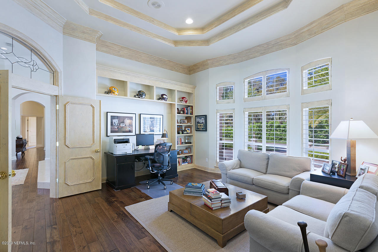 116 Governors Road Ponte Vedra Beach, FL 32082 - Photo 13 of 57 a living room with furniture couches and a dining table with wooden floor