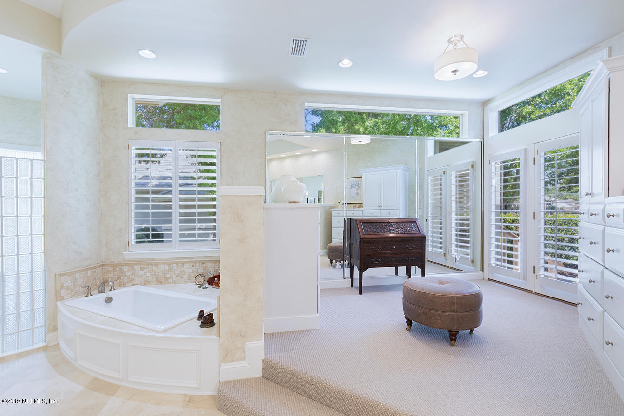 116 Governors Road Ponte Vedra Beach, FL 32082 - Photo 20 of 57 a living room with furniture and a large window