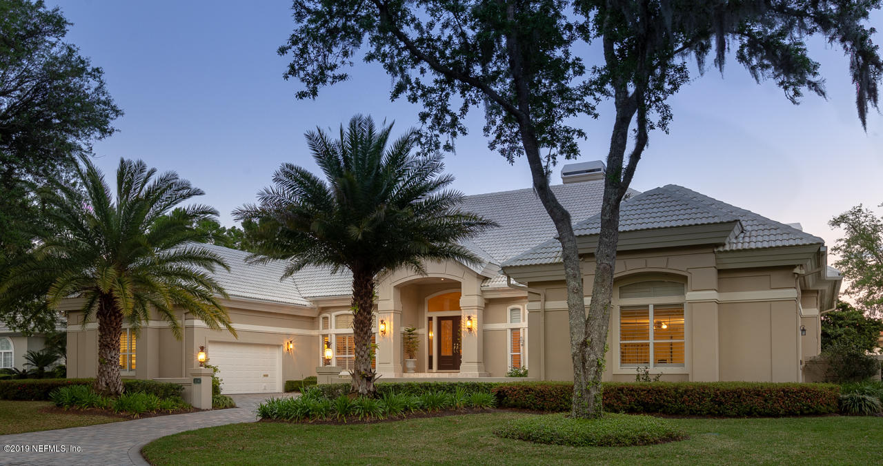 116 Governors Road Ponte Vedra Beach, FL 32082 - Photo 2 of 57 a front view of a house with a garden and trees