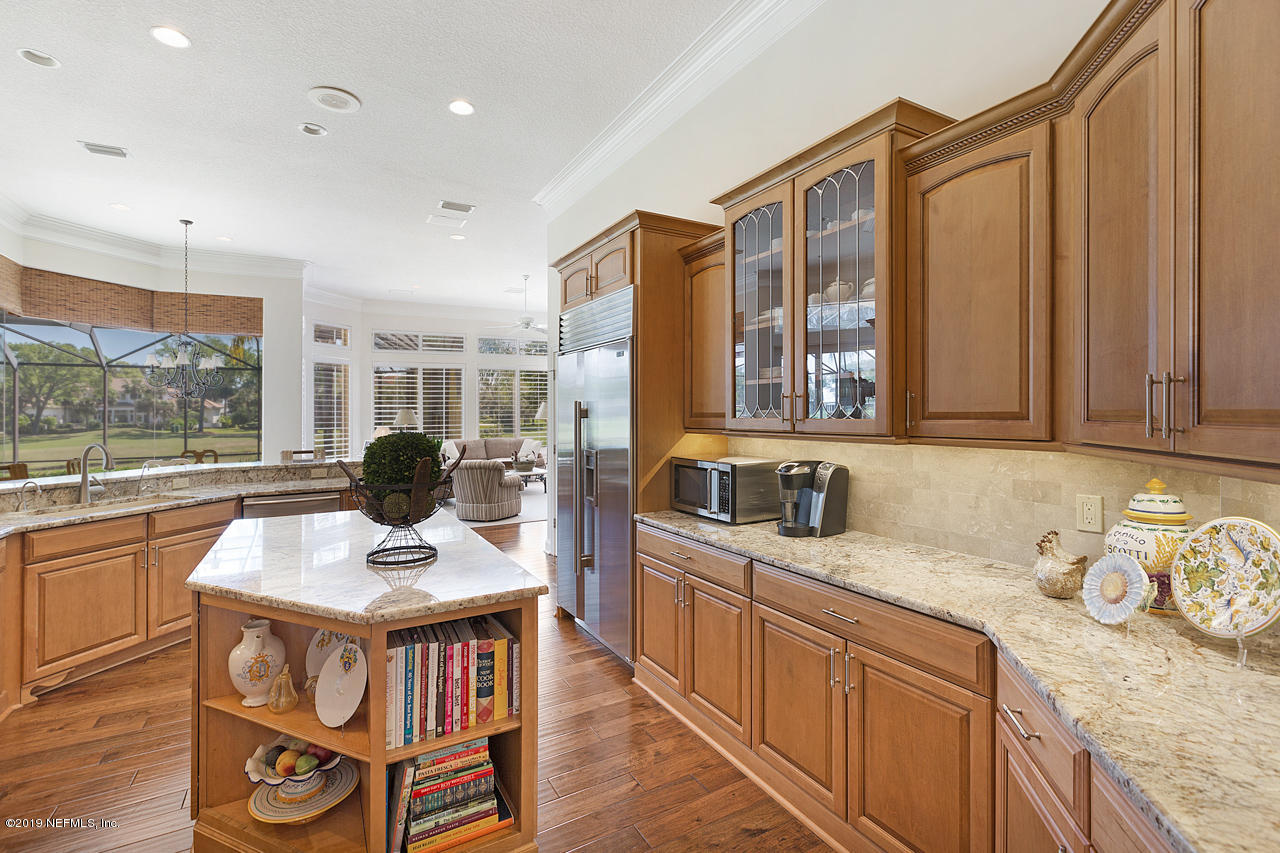 116 Governors Road Ponte Vedra Beach, FL 32082 - Photo 23 of 57 a kitchen with stainless steel appliances granite countertop a sink stove and cabinets