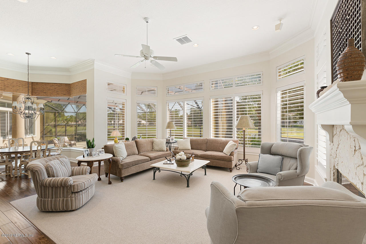 116 Governors Road Ponte Vedra Beach, FL 32082 - Photo 26 of 57 a living room with furniture and a large window