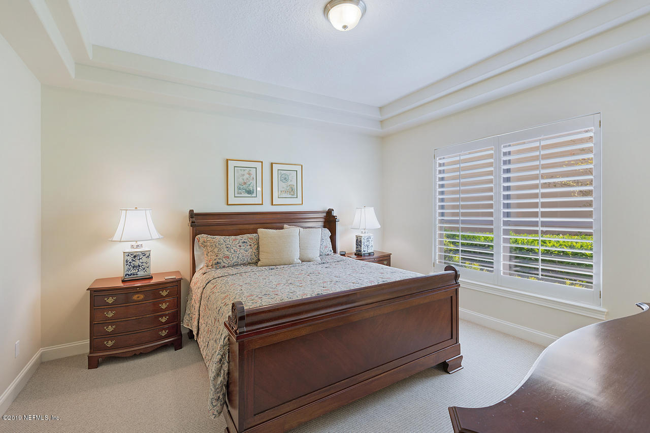 116 Governors Road Ponte Vedra Beach, FL 32082 - Photo 30 of 57 a bedroom with a bed and a couch