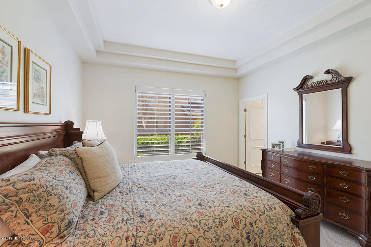 116 Governors Road Ponte Vedra Beach, FL 32082 - Photo 31 of 57 a bedroom with a bed a window and dresser