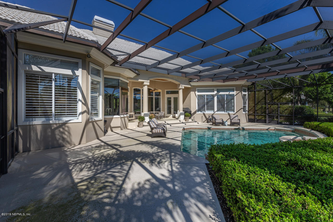 116 Governors Road Ponte Vedra Beach, FL 32082 - Photo 35 of 57 a view of a patio with table and chairs and a barbeque