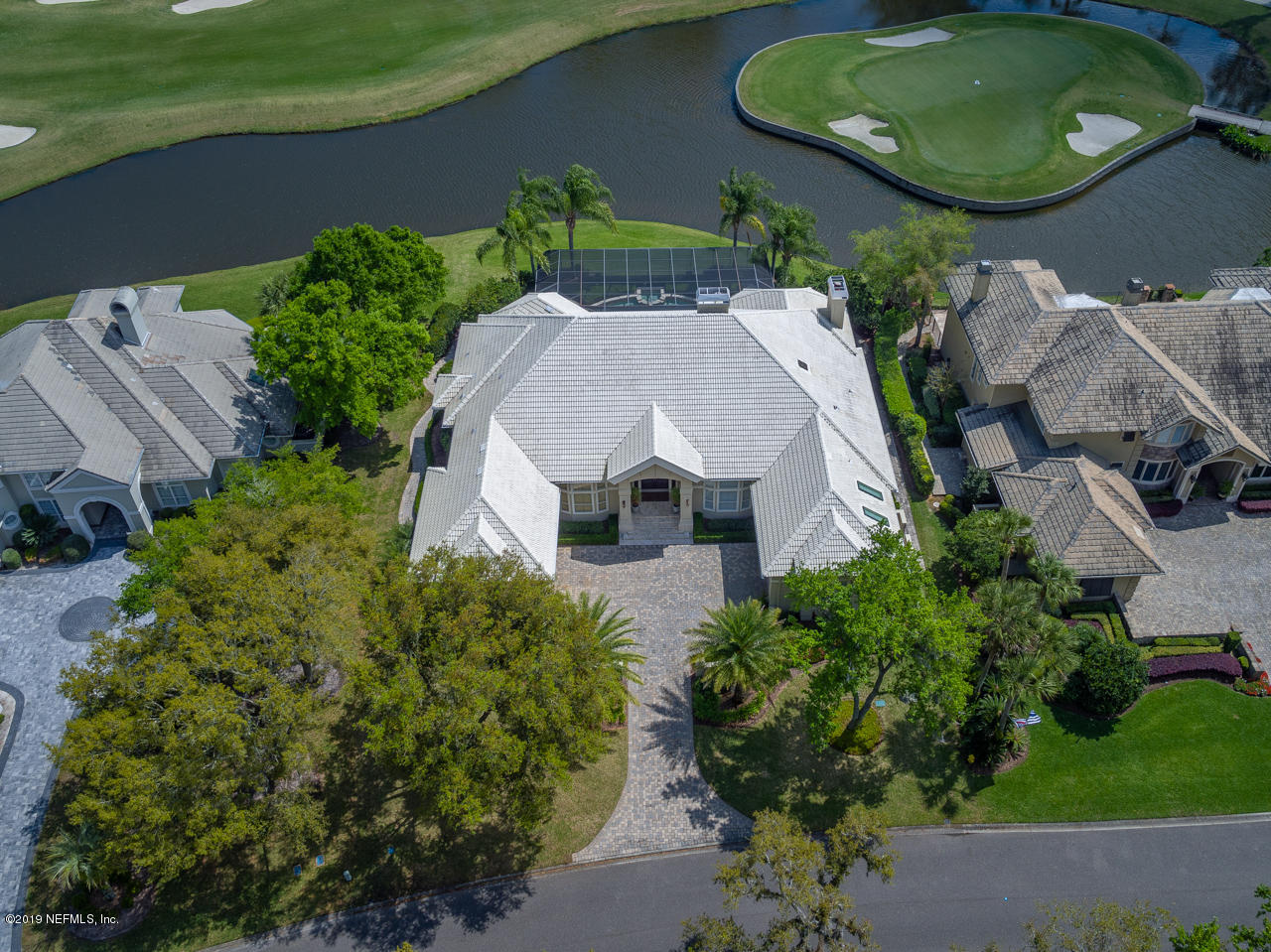 116 Governors Road Ponte Vedra Beach, FL 32082 - Photo 4 of 57 an aerial view of a house with garden space and a swimming pool