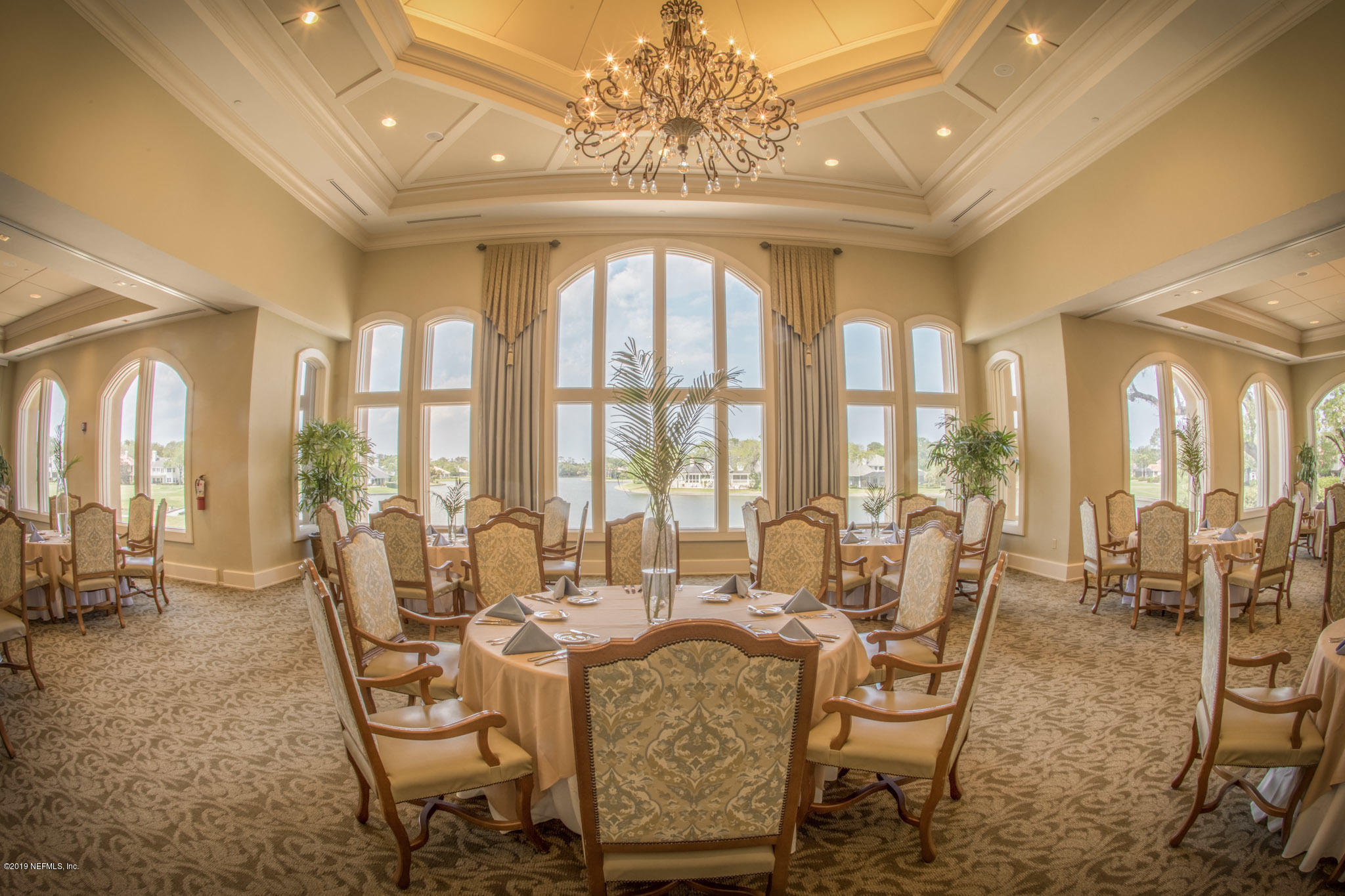 116 Governors Road Ponte Vedra Beach, FL 32082 - Photo 49 of 57 a dining room with wooden floor and large windows