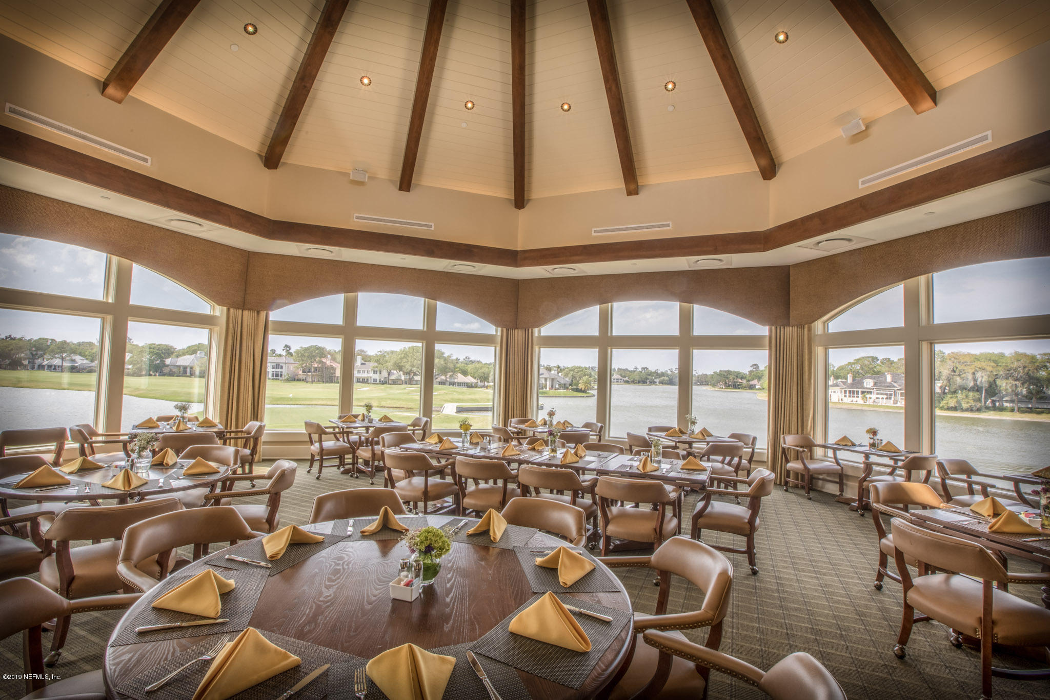 116 Governors Road Ponte Vedra Beach, FL 32082 - Photo 50 of 57 a room with lots of chairs and a large window