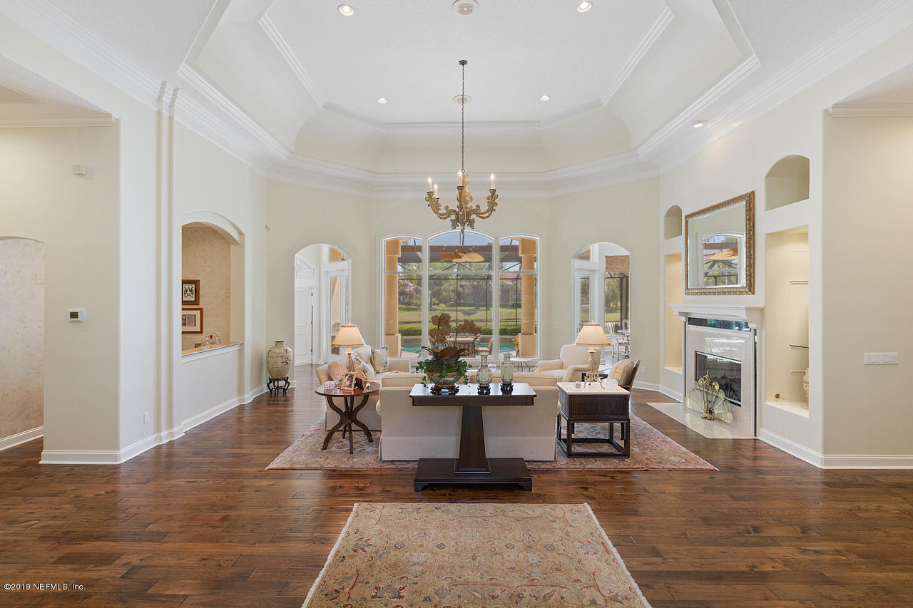 116 Governors Road Ponte Vedra Beach, FL 32082 - Photo 7 of 57 a living room with furniture large window and wooden floor