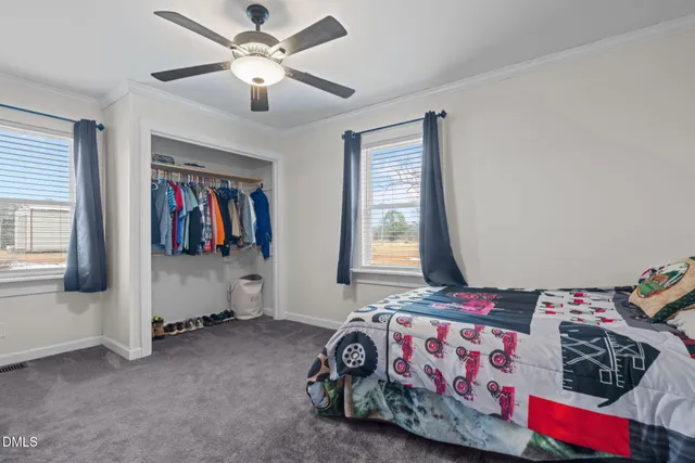 a spacious bathroom with a double vanity sink and a mirror