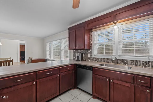 a kitchen with a sink stove and microwave