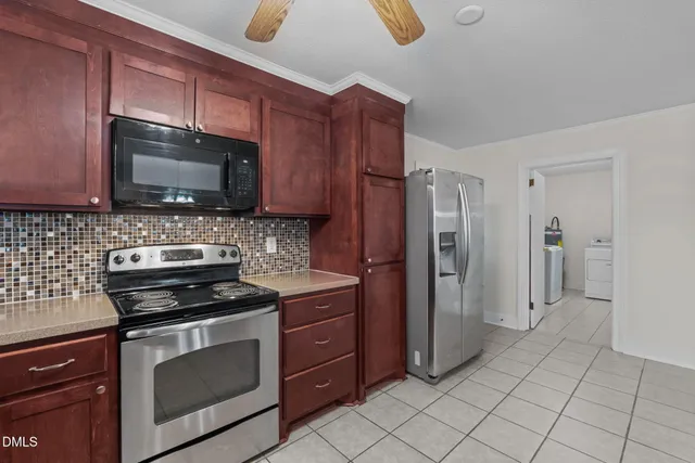 a kitchen with a sink and large window