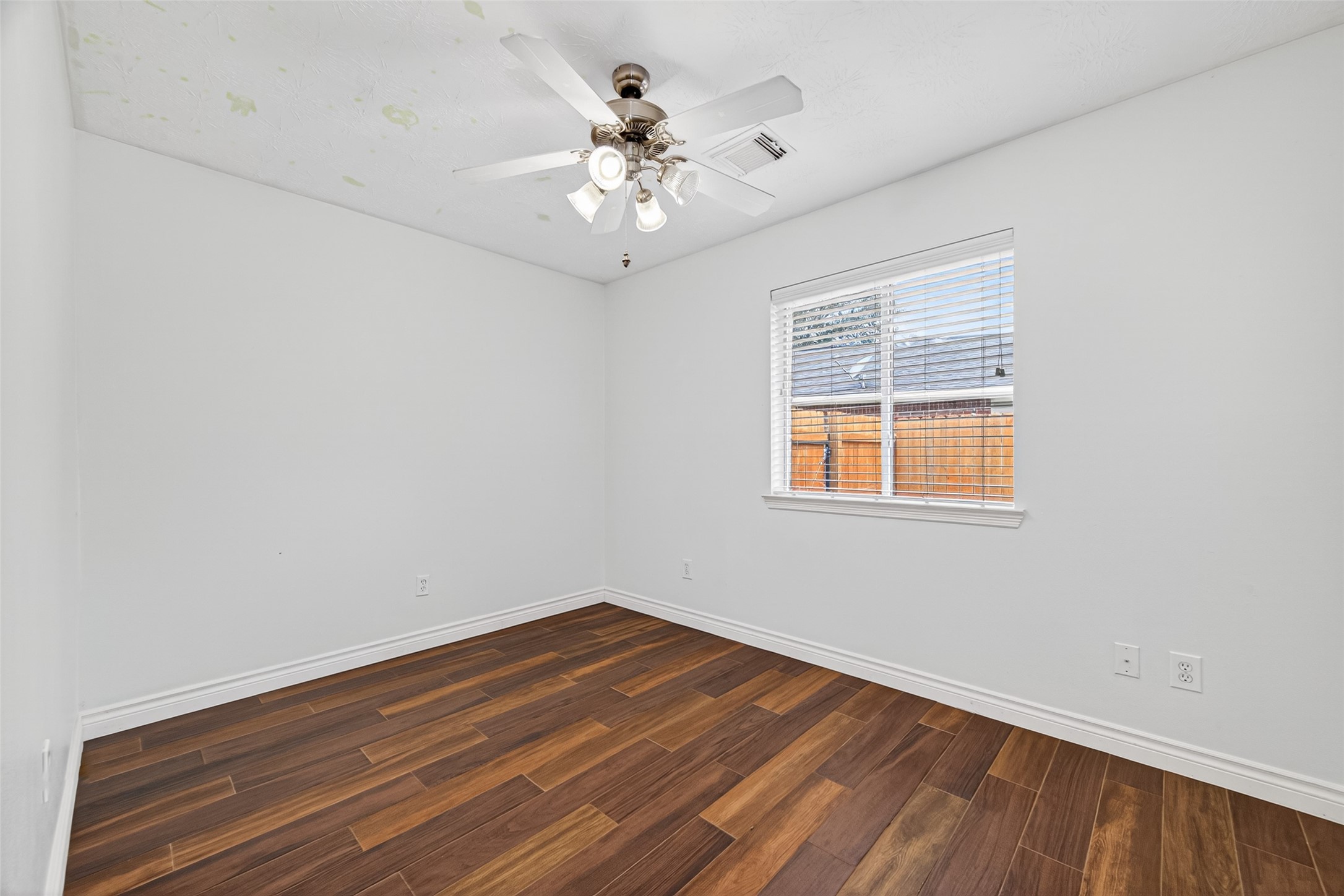 23914 Glengate Drive Spring, TX 77373 - Photo 32 of 49 wooden floor in an empty room with a window